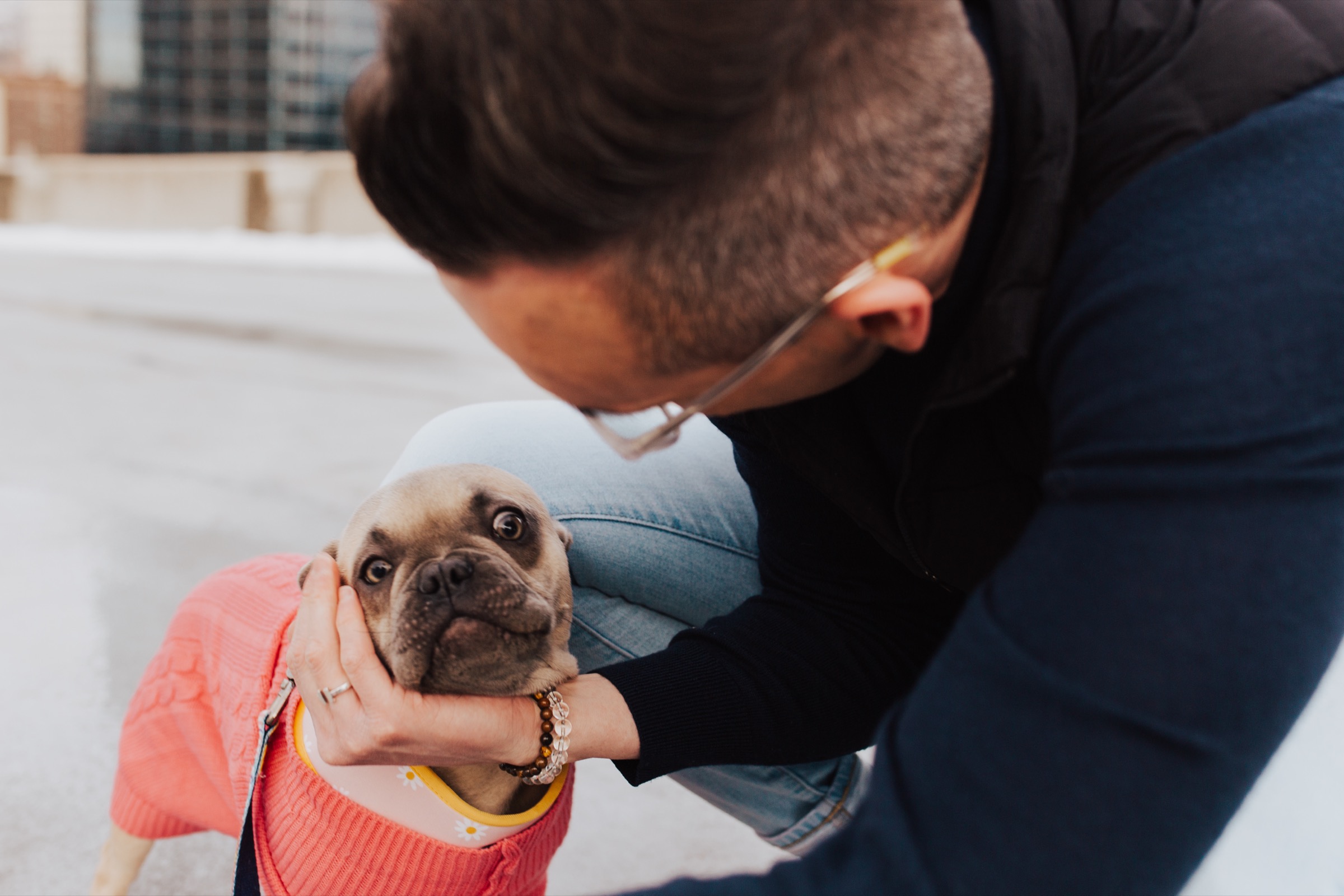 Tyler holding his dog’s face